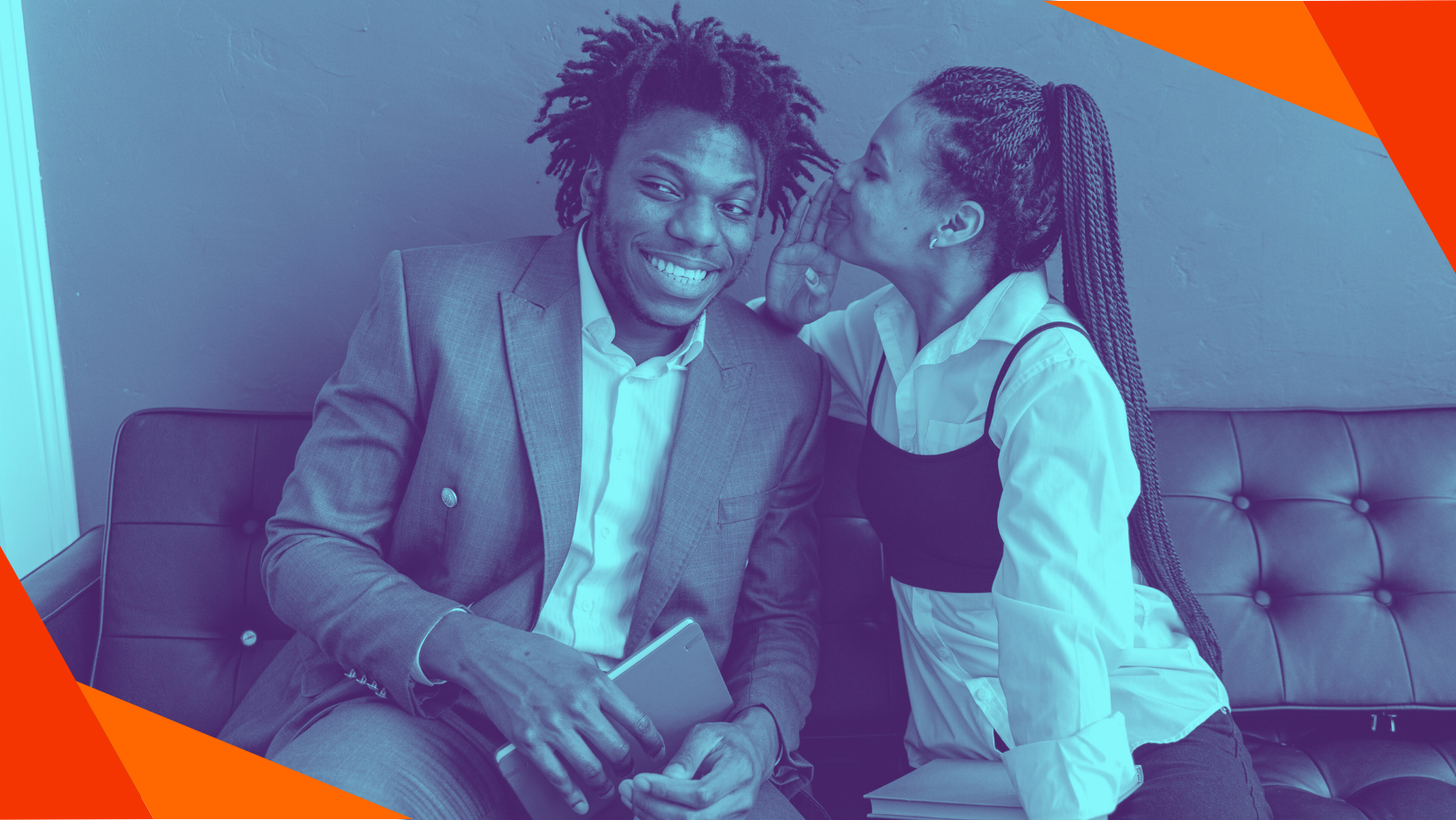 A woman whispers into a smiling man's ear