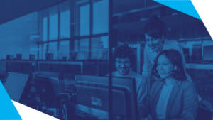 Blue Duotone Image of Three IT Professionals Smiling at a Computer Screen