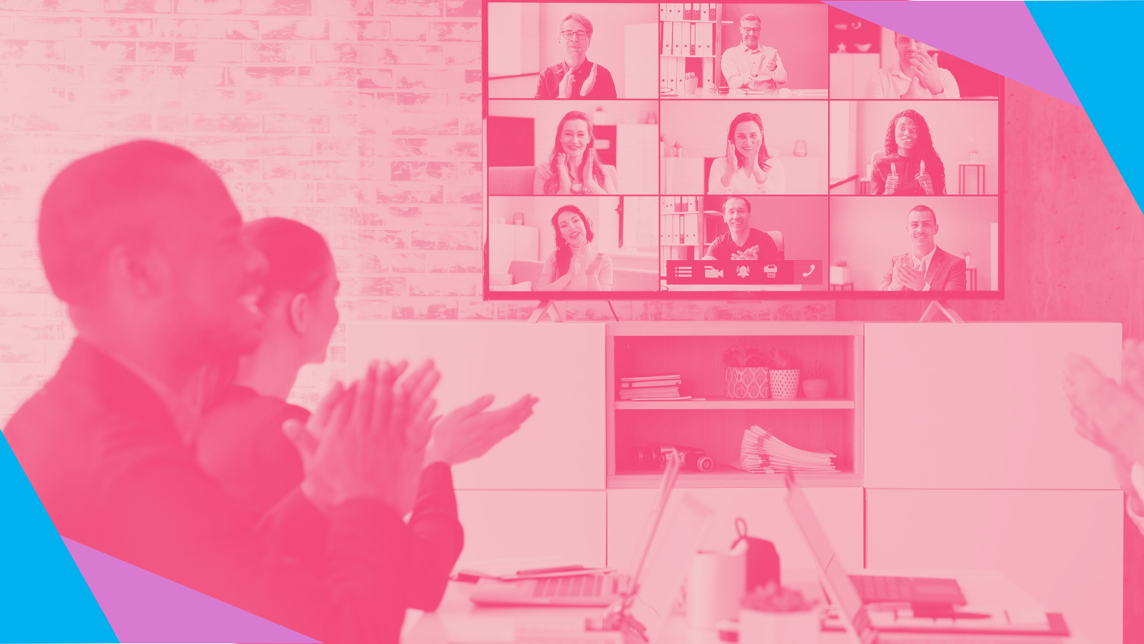 People in a meeting applauding an announcement on a screen full of virtual event attendees