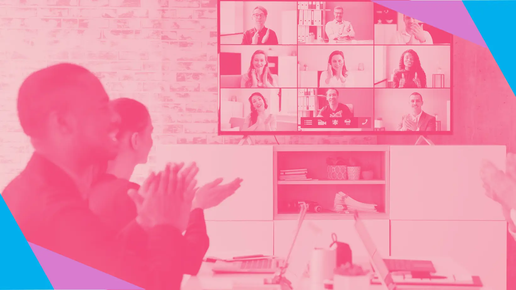 People in a meeting applauding an announcement on a screen full of virtual event attendees