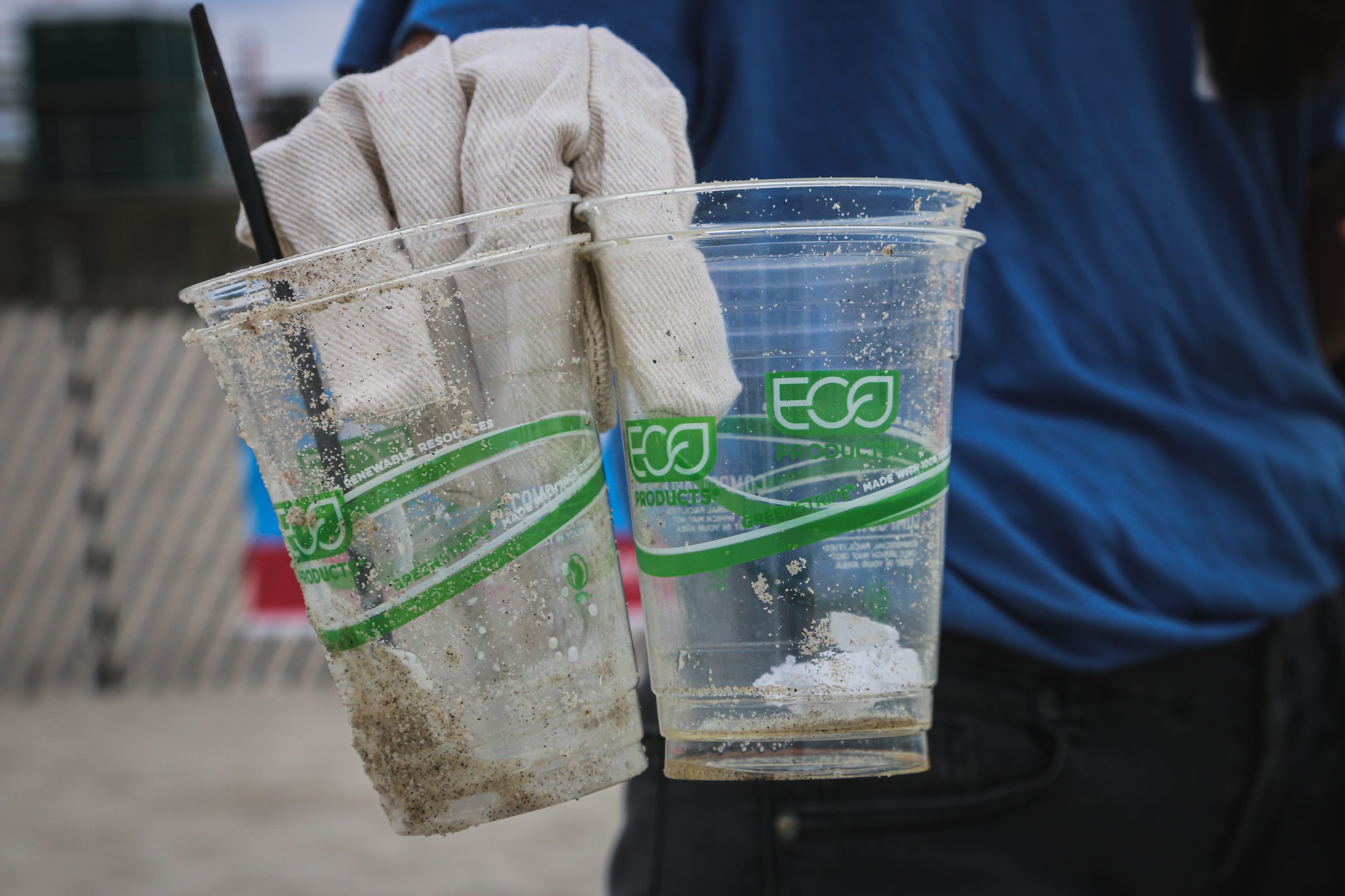 plastic cups held by cleaner