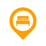 icon of bed at the centre of a pin representing accommodation