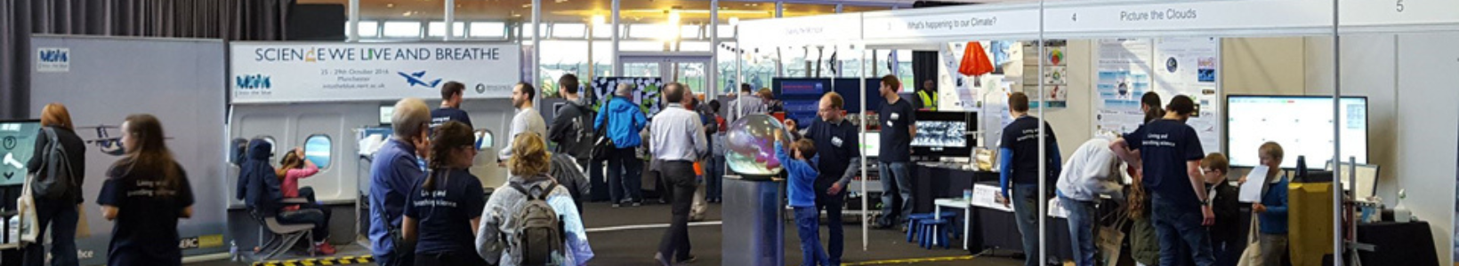 An exhibition with multiple stands hosted beneath the Concorde