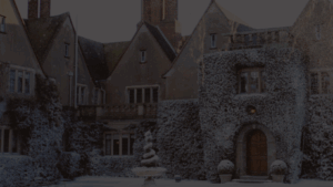 A view of the exterior of Mallory Court Country House Hotel & Spa, an old snow-covered estate