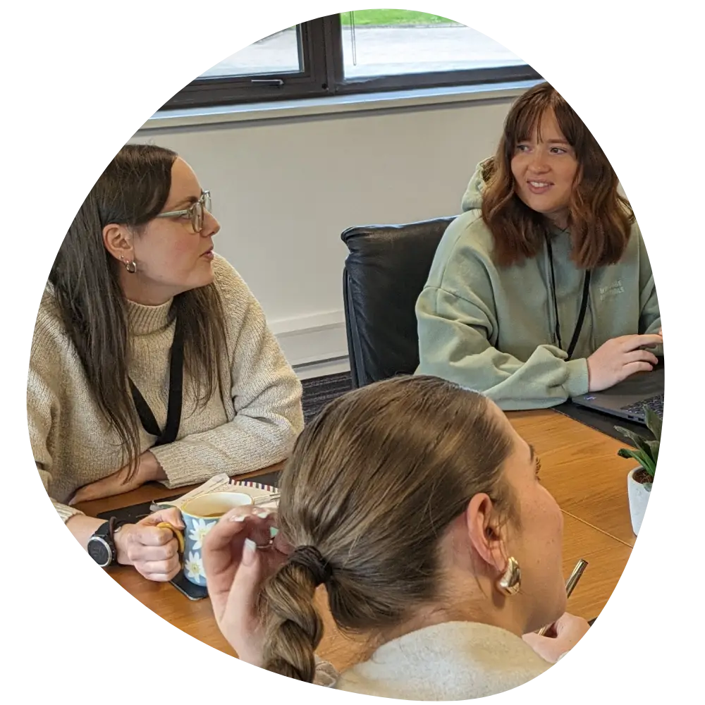 Conference Care team in a board room meeting