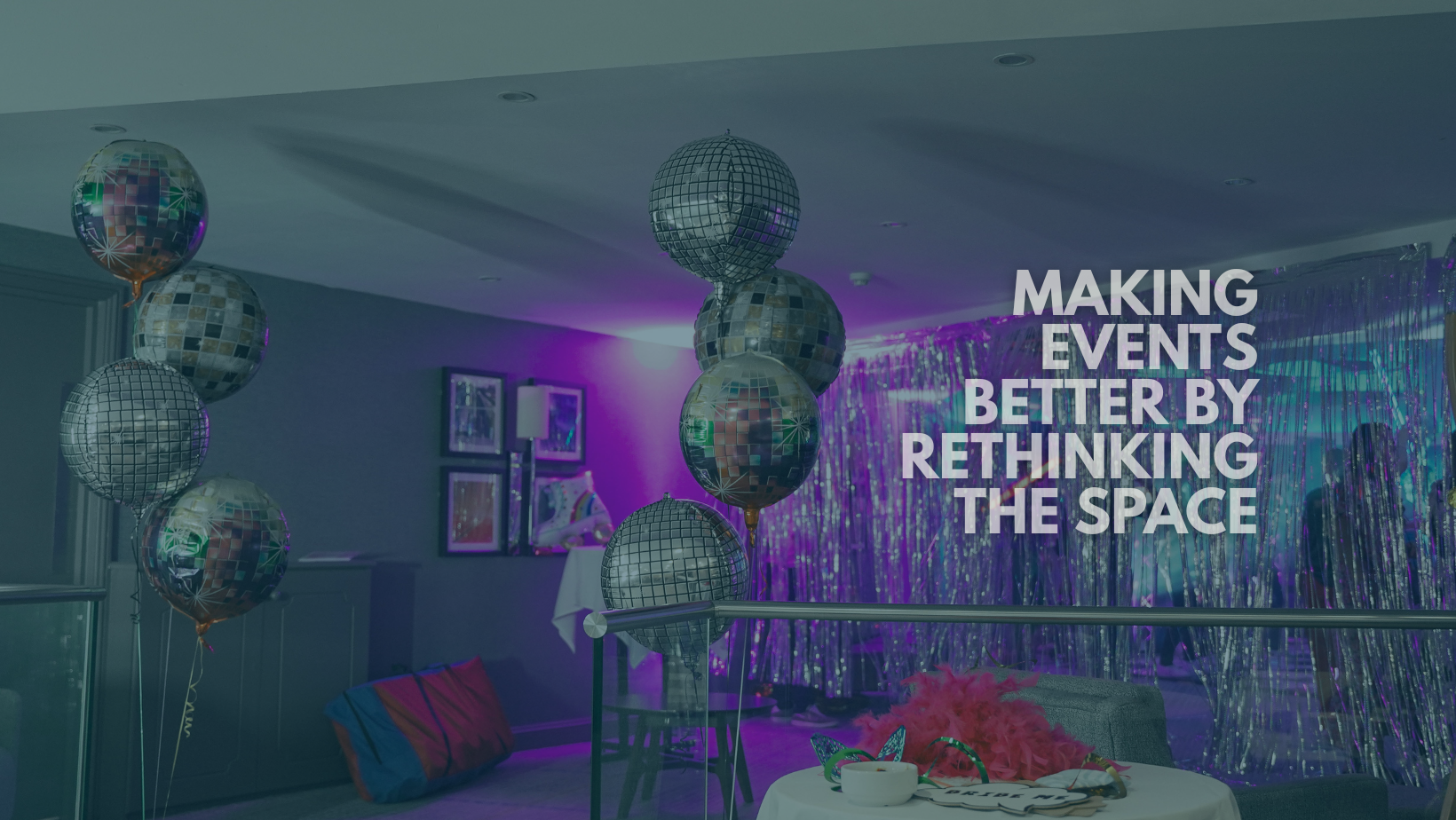 An event space decorated with disco balls and balloons