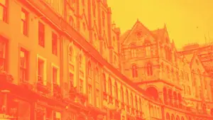 An orange duotone image of Victoria Street in Edinburgh