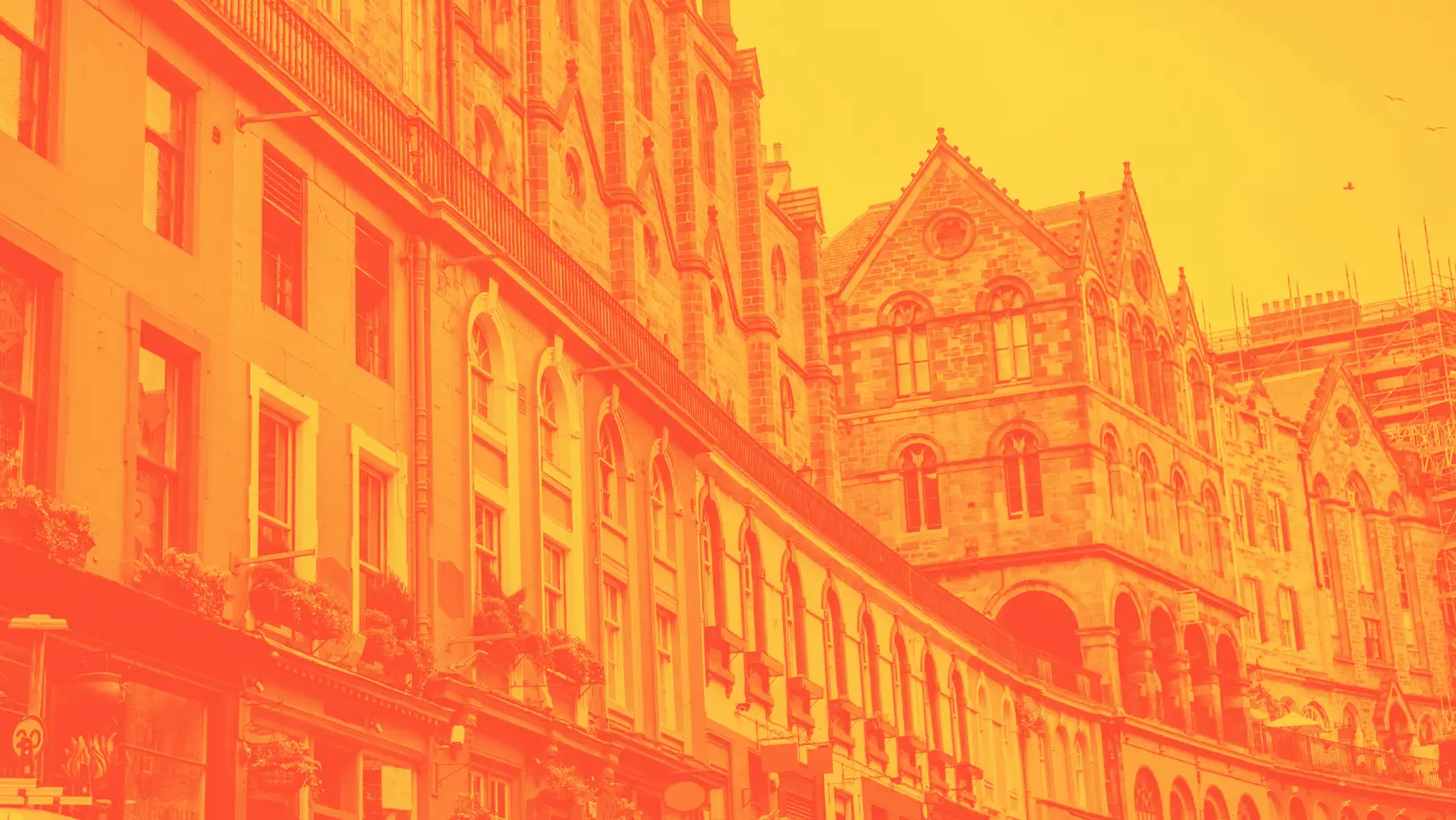 An orange duotone image of Victoria Street in Edinburgh